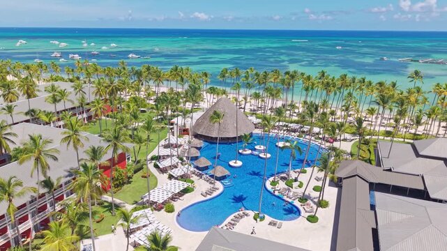 Swimming Pool Of Barcelo Bavaro Hotel With Palm Trees In Summer In Punta Cana, Dominican Republic. - aerial shot
