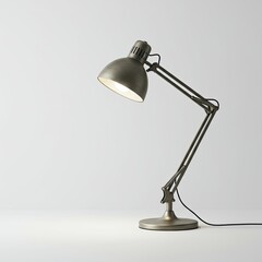 Silver Adjustable Desk Lamp Illuminating White Surface with Warm Light, Simple Studio Shot