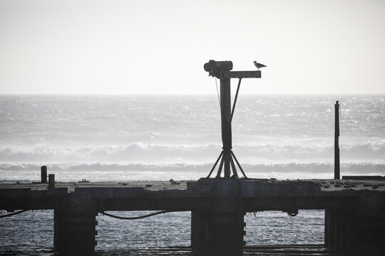End of a sea harbor pier with loading arm , Port Nolloth