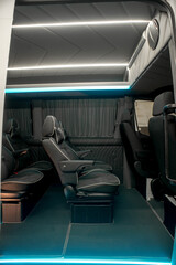 Comfortable interior of a passenger bus with soft seats