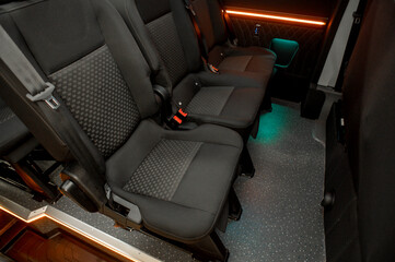 Comfortable interior of a passenger bus with soft seats