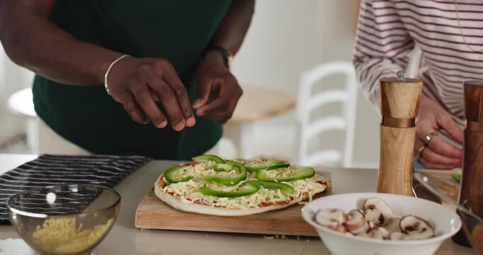 Pepper, application or hands in kitchen with pizza for dinner, meal preparation or Italian cuisine. Vegetable, garnish or people with flatbread recipe on counter for nutrition, dish or supper in home