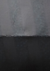 textured paper with irregular abstract patterns and subtle marks. The surface shows faint wavy shapes and imperfections, giving the sheet a unique vintage and experimental look.