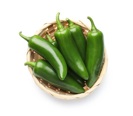 Green jalapeno peppers in basket isolated on white, top view