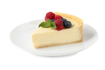 Piece of delicious cheesecake with fresh berries and mint isolated on white