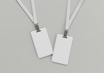 Two blank white lanyard badges on a neutral background