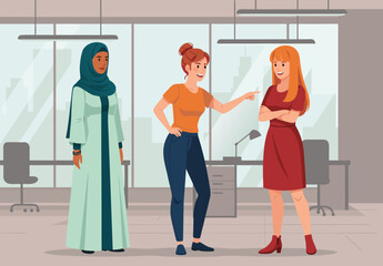 Three women talking in an office, one in a hijab, illustrating the importance of stopping bullying and promoting diversity in the workplace