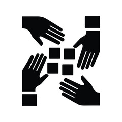 Four hands connecting and building with interlocking square blocks