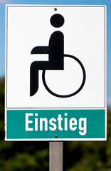 wheelchair access sign with entry symbol and text "einstieg"