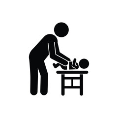 A simple black silhouette of a person changing a baby s diaper