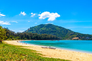 Tropical turquoise blue Mai Khao Naiyang Beach Phuket island Thailand.