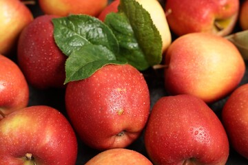 Fresh ripe apples on grey table, closeup