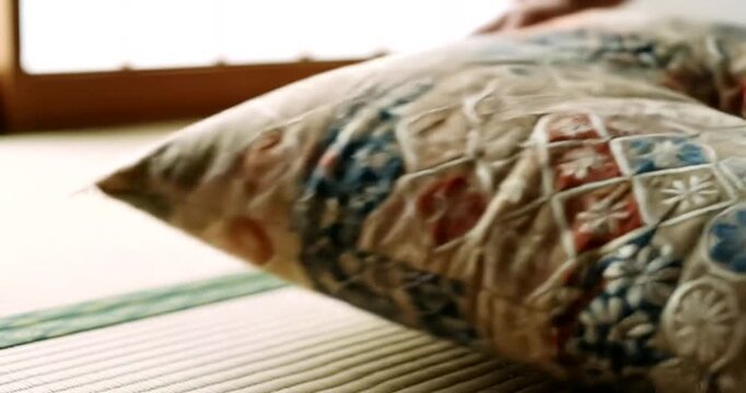 Cozy interior with a decorative pillow on a tatami mat in a serene room