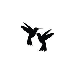 Two black hummingbird silhouettes flying vector
