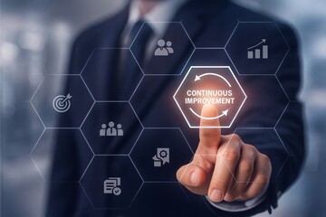 Businessman Engaging with Digital Interface for Continuous Improvement Concepts and Strategies
