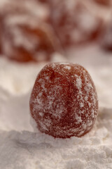 dried kumquat and white sugar, sweet dried orange kumquat fruits in white powdered sugar