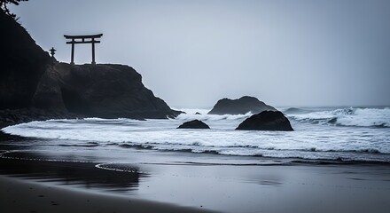 Silhouette of torii gate on rocky coast with waves crashing on shore