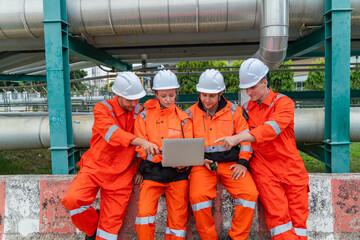 Engineering Team Reviewing Data Near Pipelines