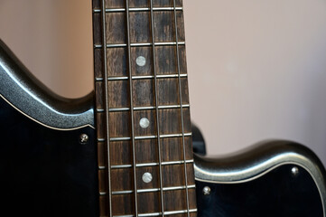 Fragment of a guitar at close range &mdash; strings, soundboard, neck.