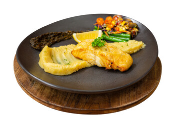 Grilled gindara with mashed potato, beans, cherry tomato and sliced of lemon. Served on black plate and sambal. Isolated picture. Transparant photo. Perfect for advertising and commercial purpose