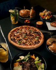 Delicious Pizza and Burger Combo with Drinks and Side Dishes – Gourmet Restaurant Food Photography