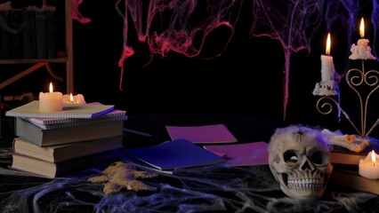 Halloween Themed Desk with Candles and Skull Decoration