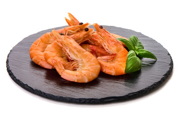 Cooked Prawns with Basil Leaves on Slate, isolated on white background