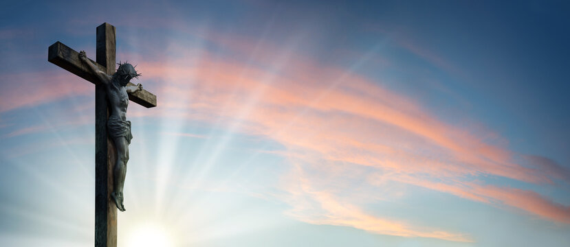 Crucified Christ hangs on the cross - Powered by Adobe