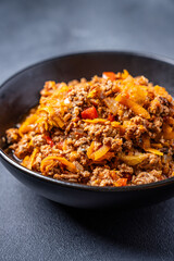 Bolognese sauce with minced meat and vegetables in bowl