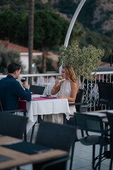 Happy couple enjoying delicious food at an open buffet restaurant during holiday.