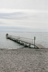 Obraz premium Wooden bathing walkway on the Baltic Sea beach in Denmark.
