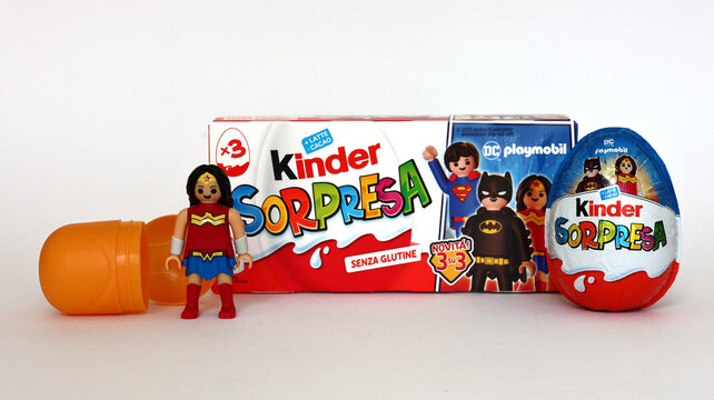 Italy &ndash; October 4, 2025: Kinder Surprise eggs by Ferrero with Wonder Woman Figurine. 2025 Edition featuring DC Playmobil Superhero characters