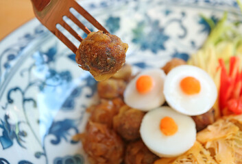 Luk Kapi or shrimp paste ball, one of the essential side dishes to have with Khao Chae, a signature Thai dish during summer