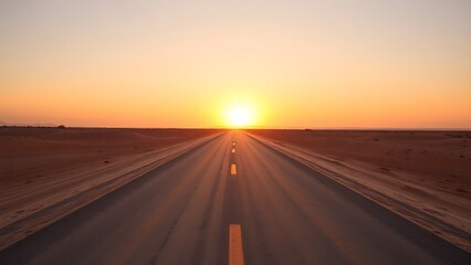 A desert road splits under a golden sunset, creating a striking contrast with warm hues.