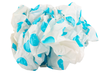Crumpled opaque plastic bag with blue dotted pattern on white background waste and environmental concept
