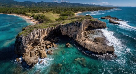 Fototapeta premium Bird's Eye Perspective of Cueva Del Indio: Coastal Rock Formation Surrounded by Pristine Waters and Vibrant Blue Sky, Hatillo, Puerto Rico