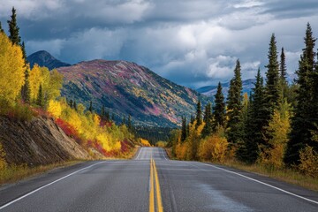 Fototapeta premium Scenic Autumn Drive Along the Klondike Highway: A Serene Journey Through Yukon, Canada with Vibrant Fall Colours and Majestic Clouds