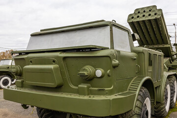 Obraz premium Soviet and Russian multiple rocket launchers. Field jet complex. A combat vehicle mounted on a truck chassis. Weapons with increased firepower. Heavy vehicle with multiple rocket launcher system.