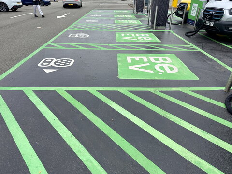 Birmingham-UK- September 2- 2025 - Electric vehicle charging point marked by green lettering and markings in a car park.Be.EV	