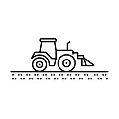 Tractor with front loader working on agricultural land
