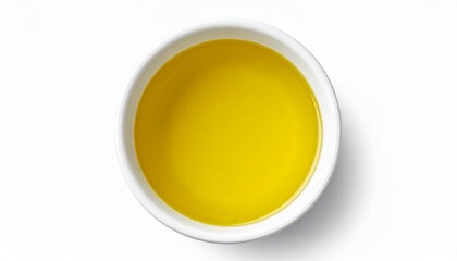 Describe a white bowl of golden-yellow olive oil surrounded by green olive leaves and three green olives on a white surface. Highlight its purity, symmetry, and natural culinary origin.