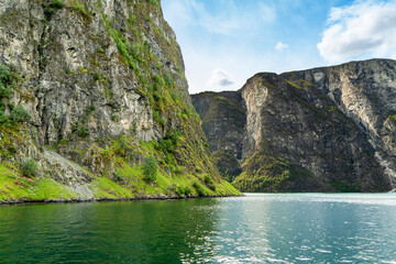 Imposing cliffs and calm waters Naeroyfjord vista