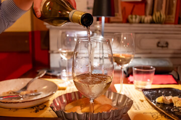 Drinking of white wine in restaurant for dinner, glasses of white wine in Italy, France, European lifestyle