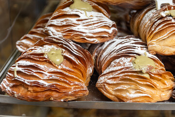 Italian desssert, Naples dessert with pistachio sfogliatella, shell-shaped layered pastry, with...
