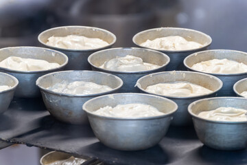 Baking of Polenta e Osei di Bergamo Alta, most renowned sweet specialty of Bergamo’s cuisine, made from sponge cake, chocolate, butter, hazelnut creams, rum