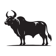 Silhouette of a majestic bull with prominent horns standing on a grassy field