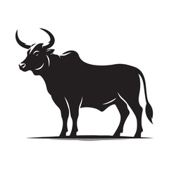 Silhouette of a majestic bull with prominent horns standing on a grassy field