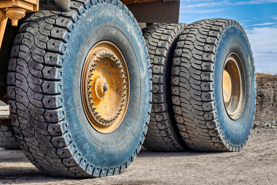 Fototapeta giant wheels and tires of a mining dump truck , diamond mining transporting kimberlite from the crusher, Africa