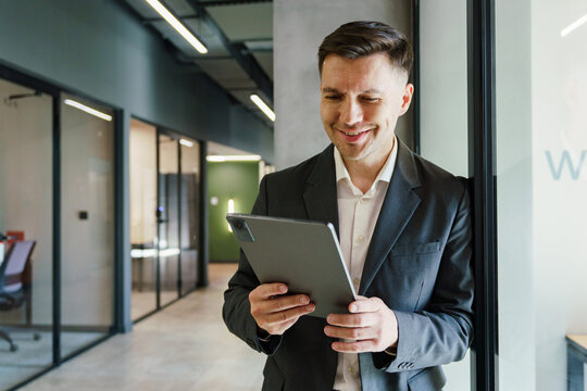 Business professional using tablet in modern office environment