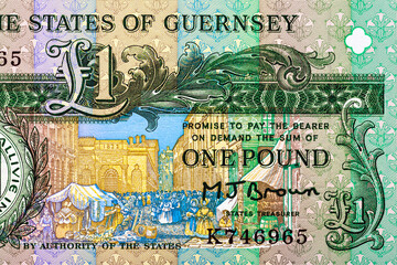 Guernsey 1 Pound 1991 Banknotes. Daniel De Lisle Brock, Channel Island bailiff.Seal of The States of Guernsey; The Market (French Halles).Bonistics.Fragment banknote for design purpose.